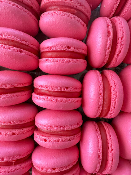 raspberry macarons filled with raspberry ganache and homemade raspberry jam.